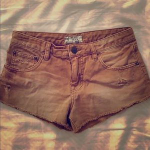 Free People distressed burnt orange jean shorts